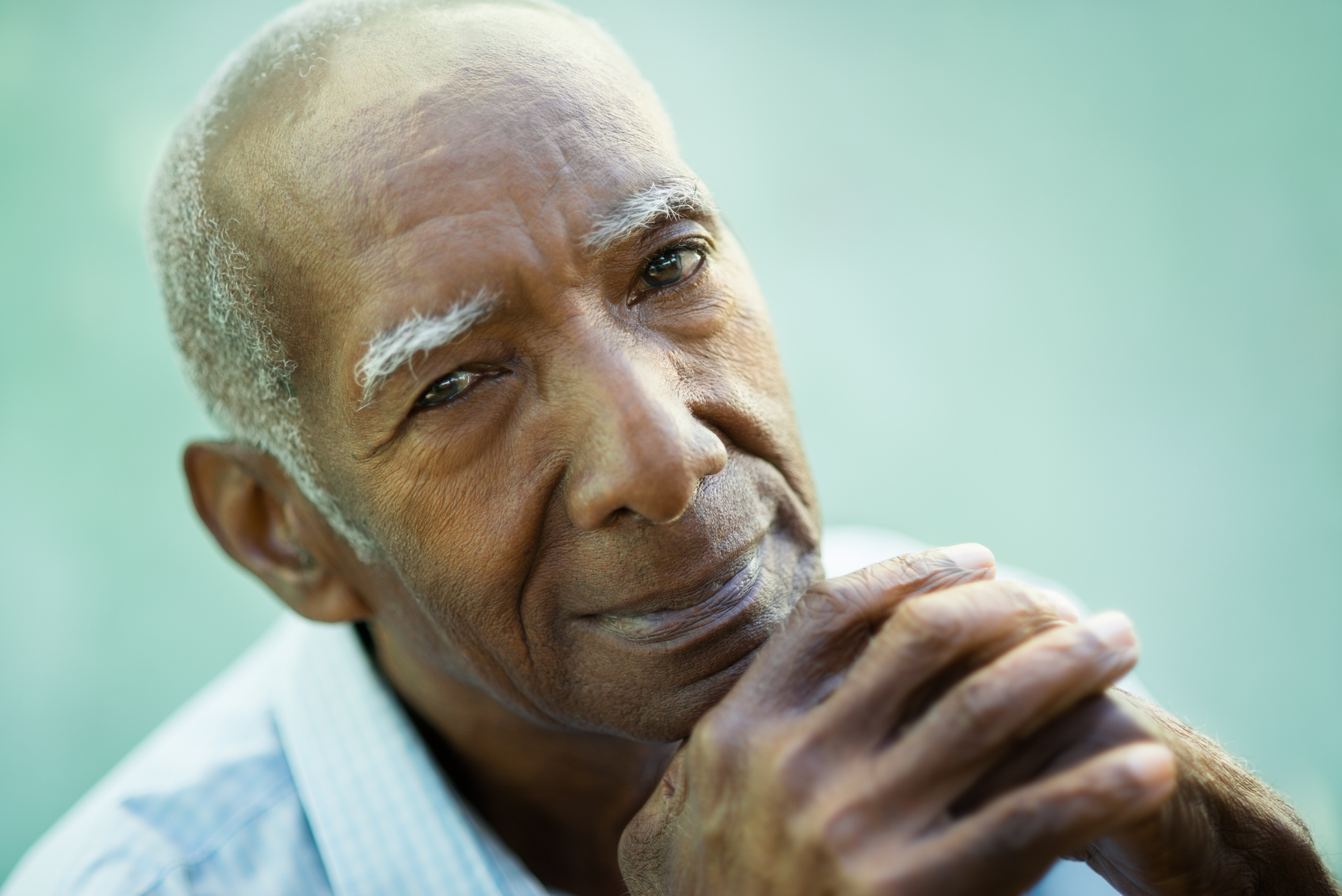 Closeup of happy old black man smiling at camera