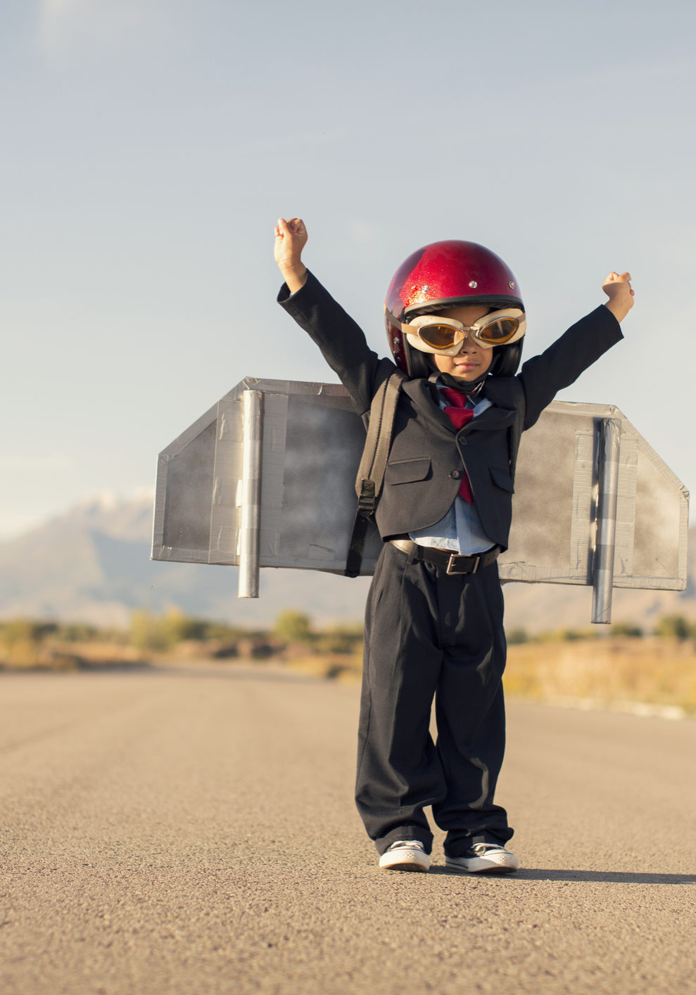 Young Boy Wearing Business Suit and Jet Pack